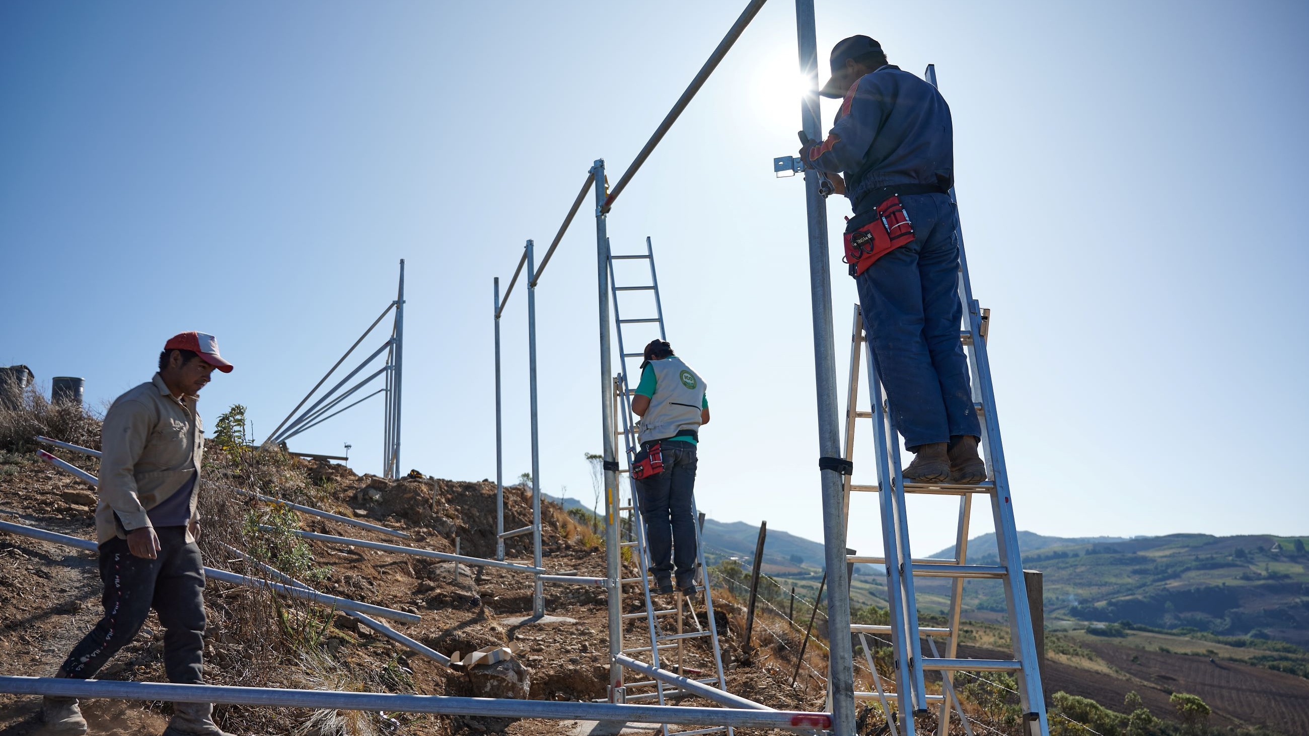 Builders setting up the fognets on the sites