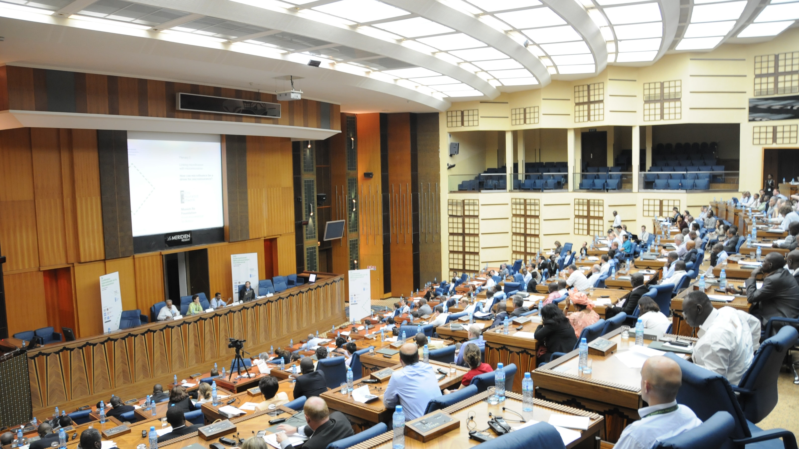 Participants sit in the conference hall