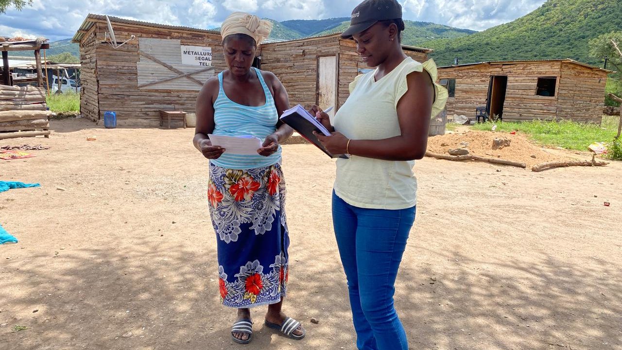 A staff member of the AWARD is conducting an interview with a local resident.