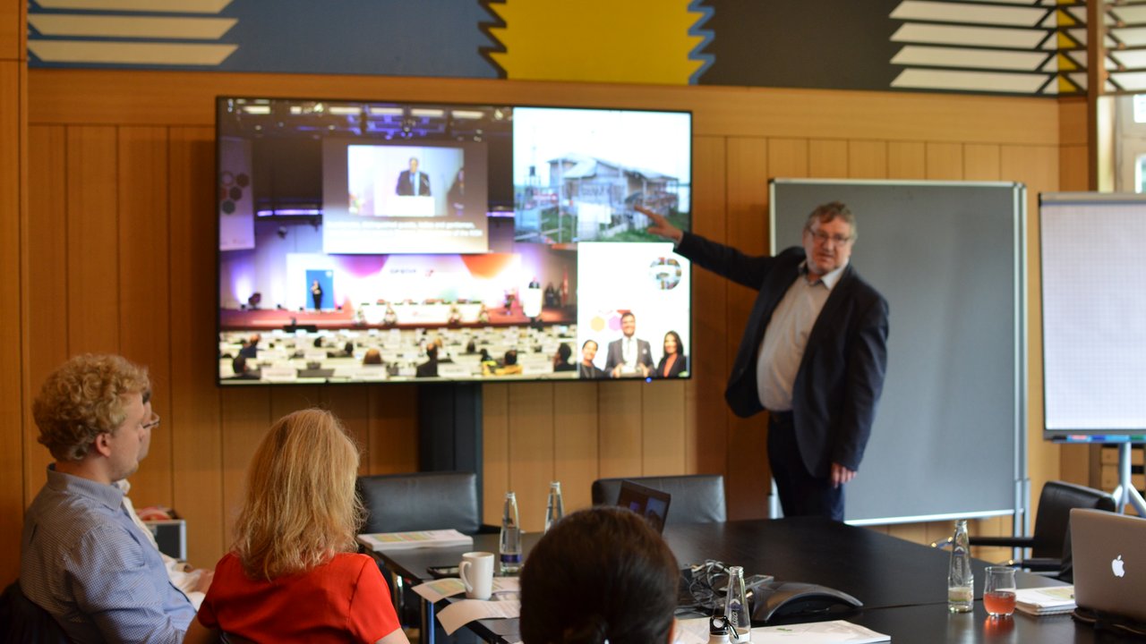 Various topics were discussed in eight sessions. Climate risk insurance was a core theme, presented by Thomas Loster, MRF.