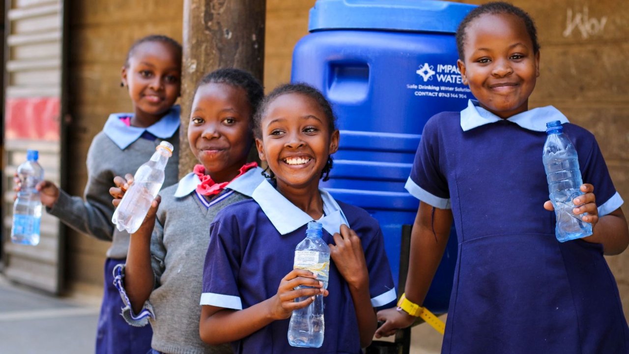 children drinking filtered water at school 